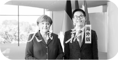 楊祺軒與德國總理默克爾采訪后留影