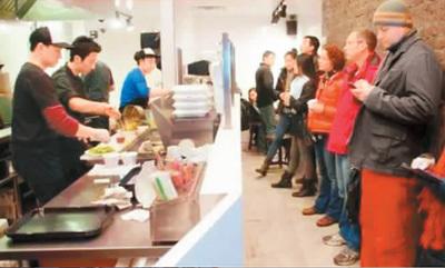 中國僑網(wǎng)圖為“西安名吃”餐館,。(資料圖片)