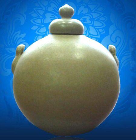 中國(guó)僑網(wǎng)五代越窯密色蓋罐。(意大利歐聯(lián)網(wǎng)/收藏者提供)